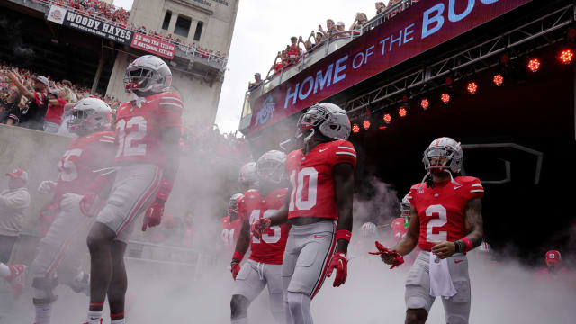 (l-r) Ohio State Buckeyes offensive lineman Matthew Jones (55), Ohio State Buckeyes safety Brenten Jones (32), Ohio State Buckeyes cornerback Denzel Burke (10) and Ohio State Buckeyes wide receiver Emeka Egbuka